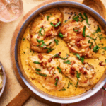 Ingredients for marry me chicken including chicken breasts, sun-dried tomatoes, heavy cream, Parmesan and garlic.